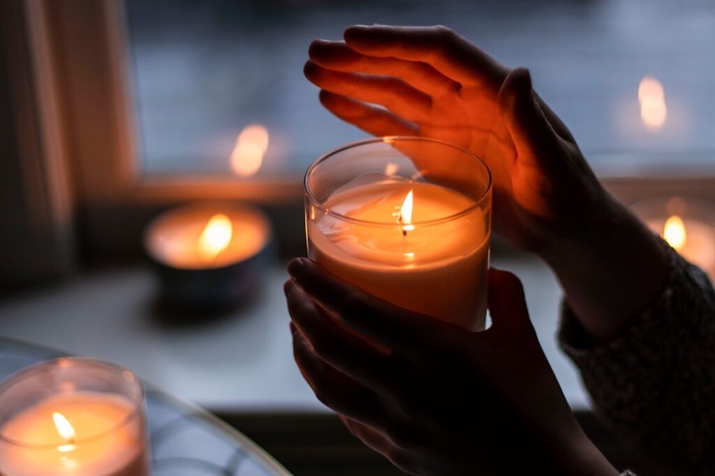 Photo of a candle being held